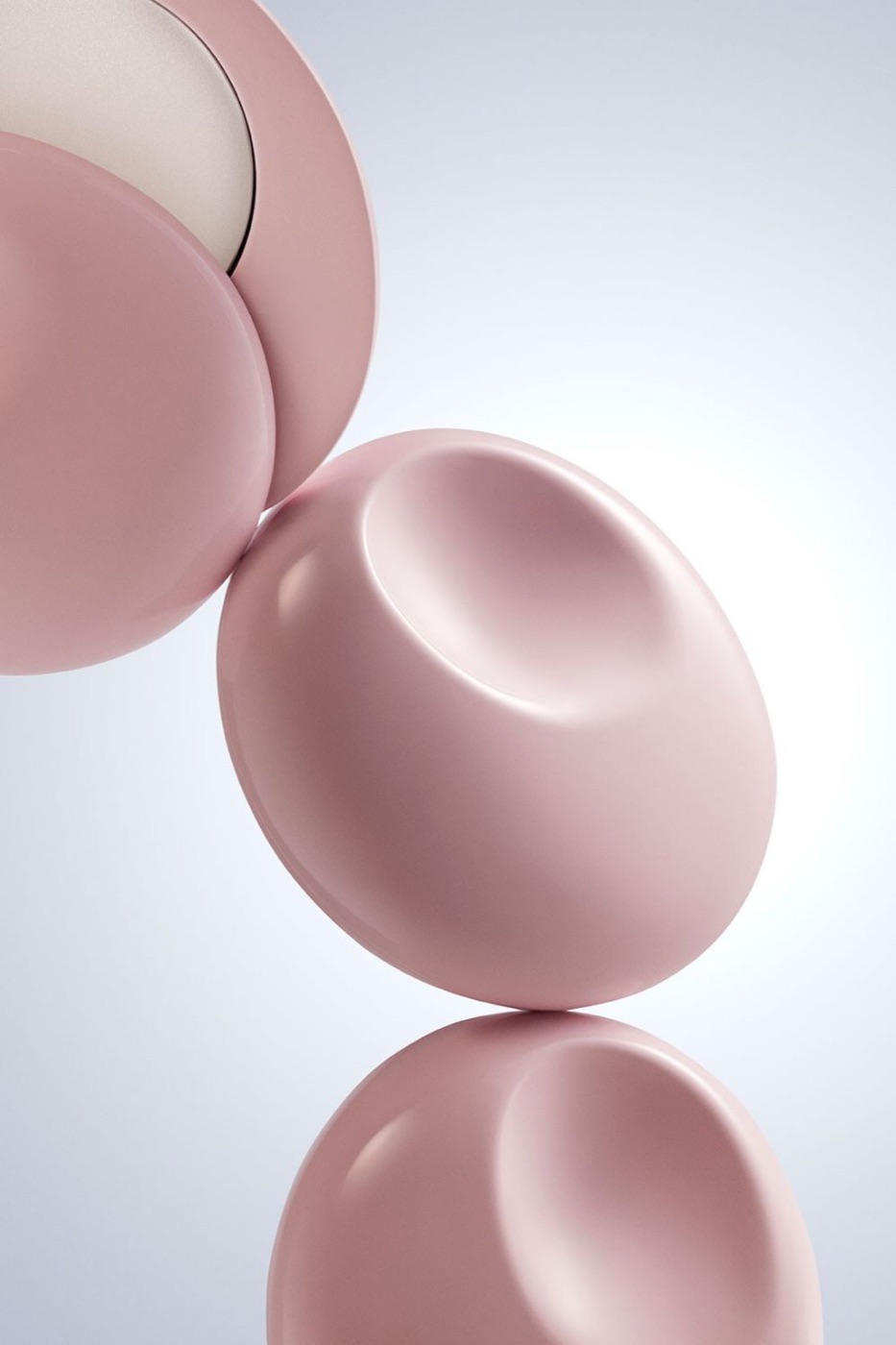 Pink pastel solid perfume cases photographed as sculptural beauty objects.
