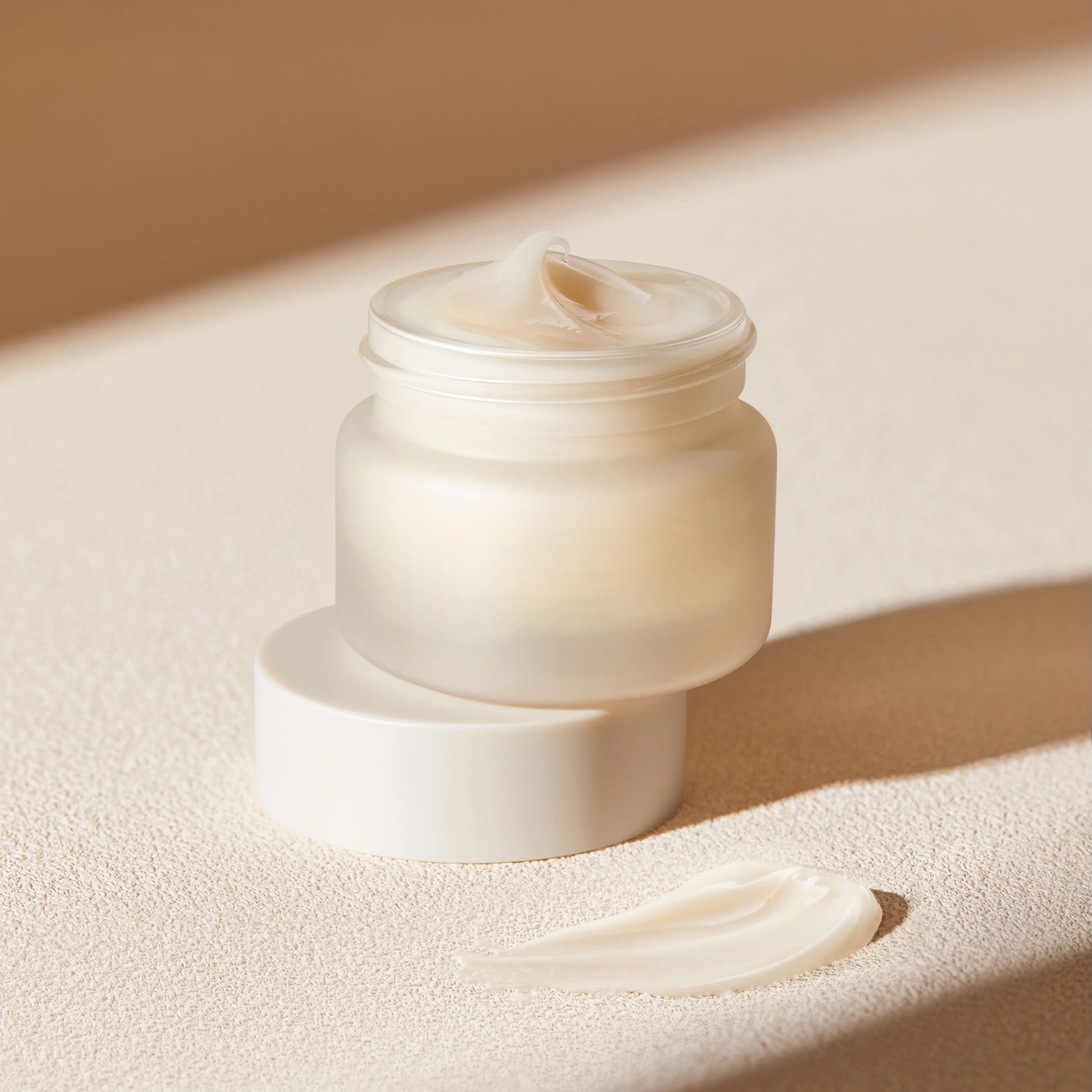 Warm color skin care product face cream cover opening cream application